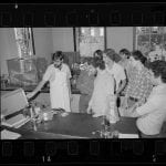 a photograph of several students and an instructor in a neuroscience lab